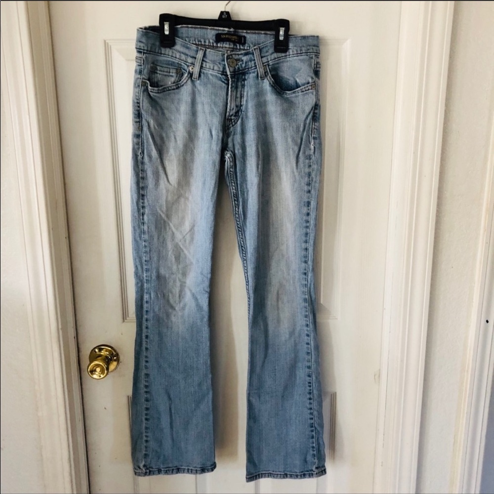 levis distressed woman’s bootcut jeans